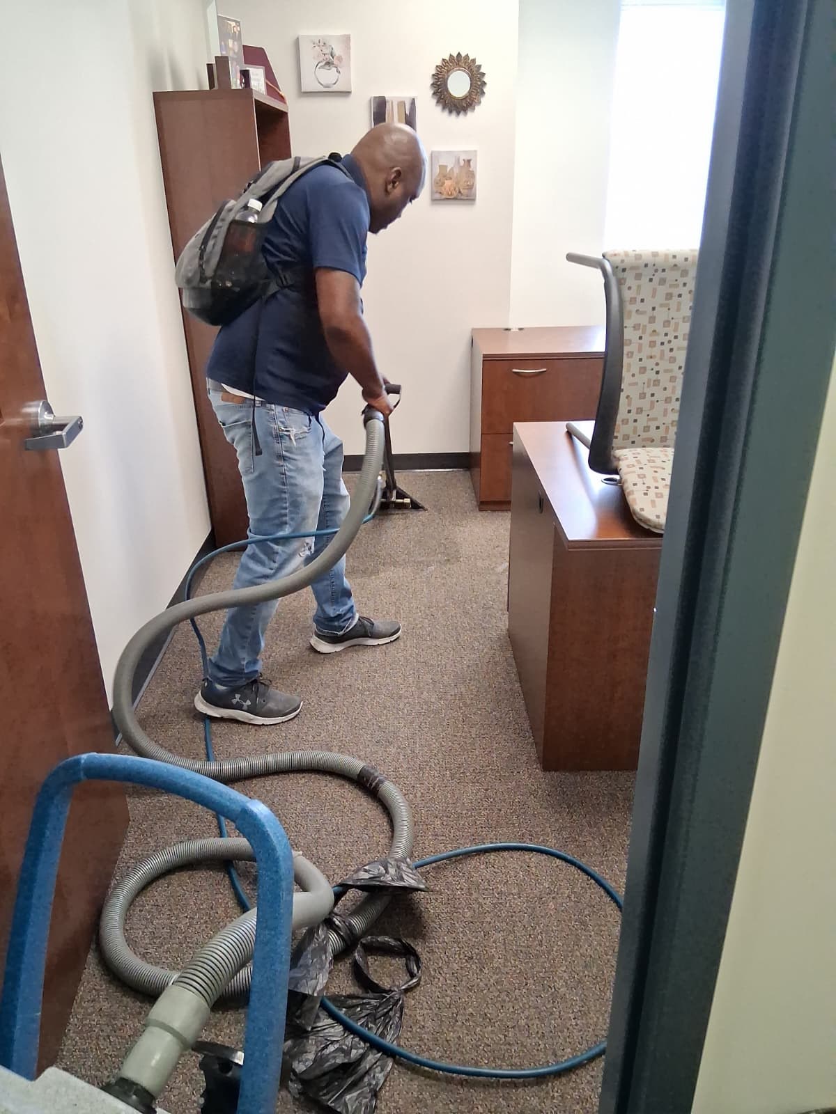 Montoya team member extracting dirt from carpet
